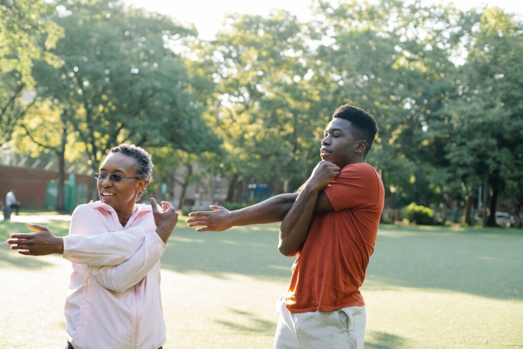 Mom and son doing shoulder stretch