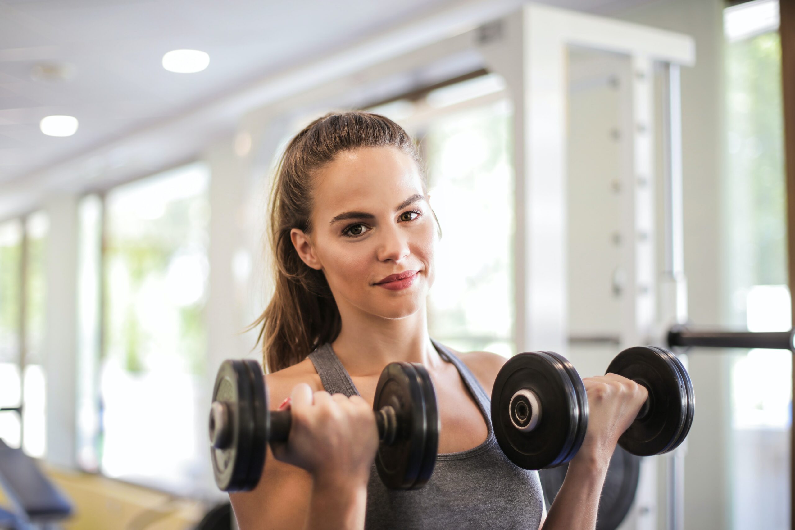 Woman working out with dumbbells