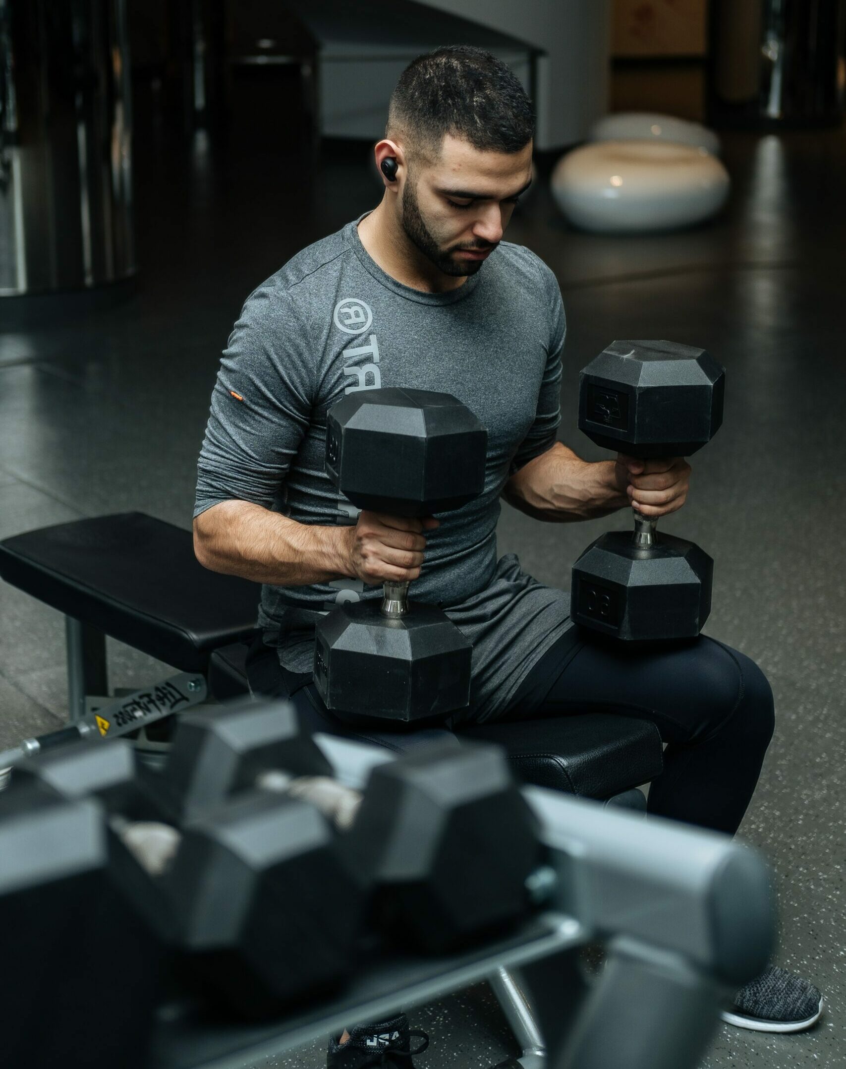 Man with dumbbells ready to lift