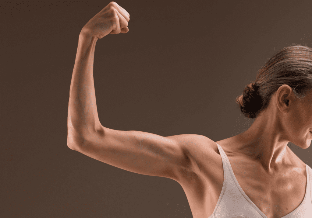 Woman flexing very toned arm.